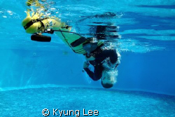 Sea kayak rolling demonstration in a pool. by Kyung Lee 